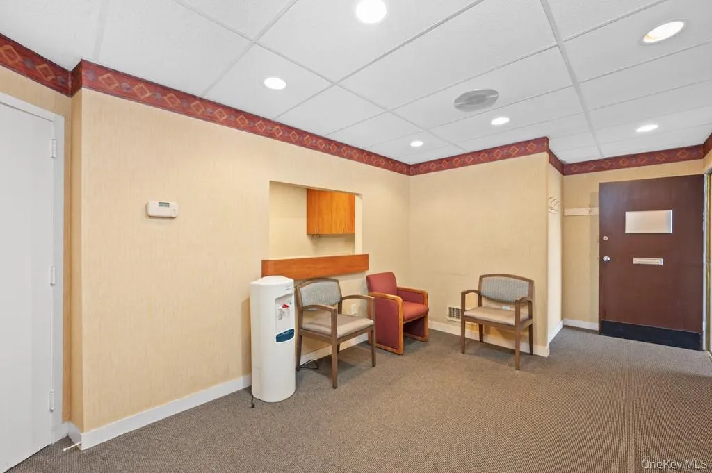 Office area featuring a paneled ceiling and recessed lighting Office area featuring a paneled ceiling and recessed lighting