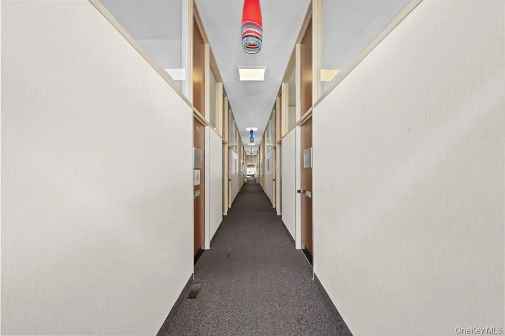 Corridor with dark carpet Corridor with dark carpet