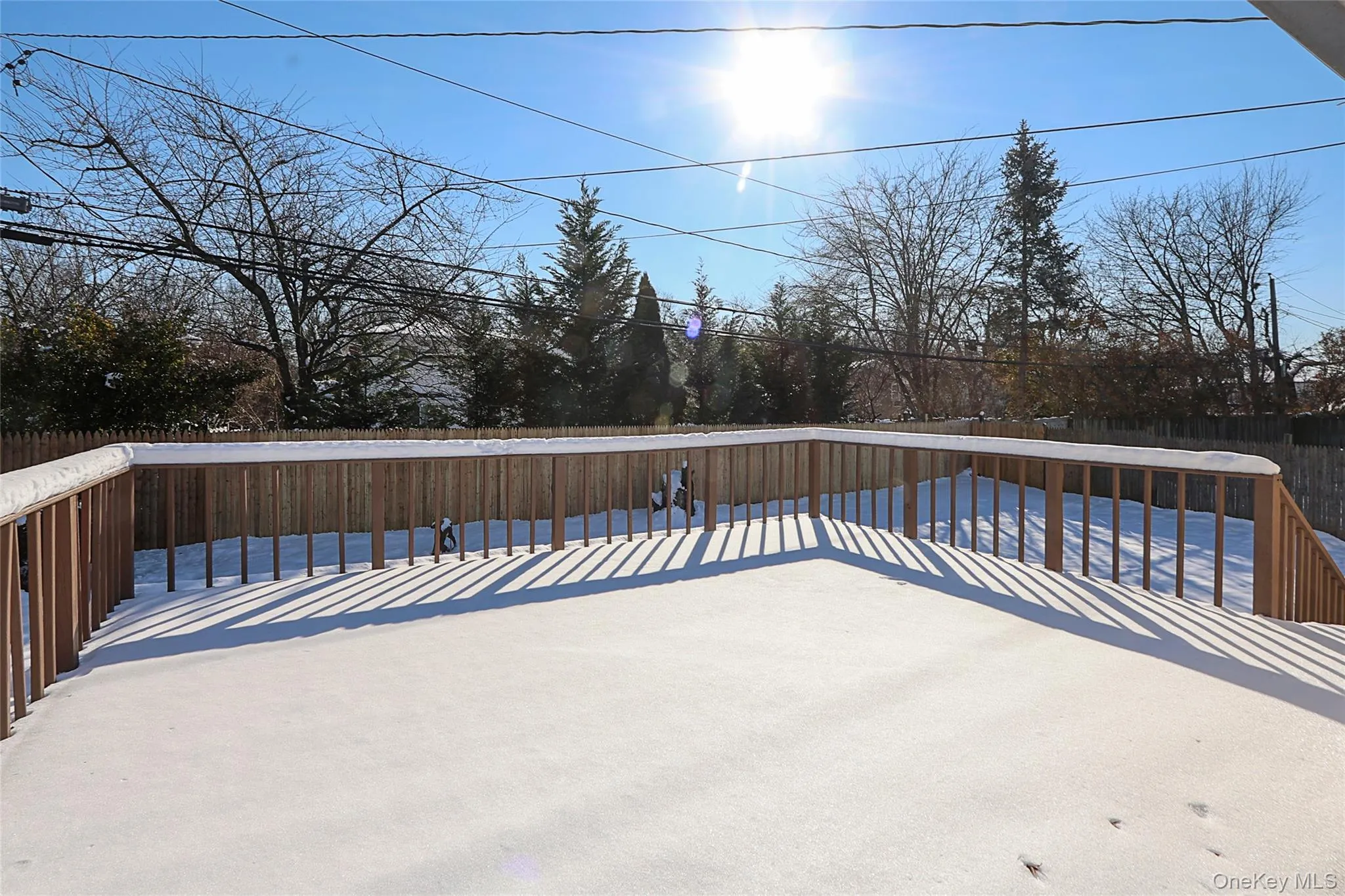 Deck featuring a fenced backyard Deck featuring a fenced backyard