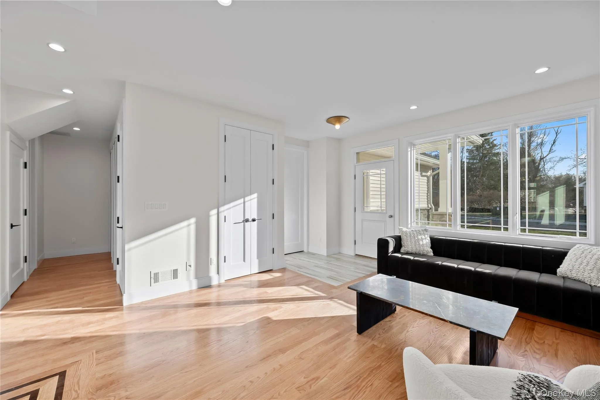 Living room featuring recessed lighting and light wood finished floors Living room featuring recessed lighting and light wood finished floors