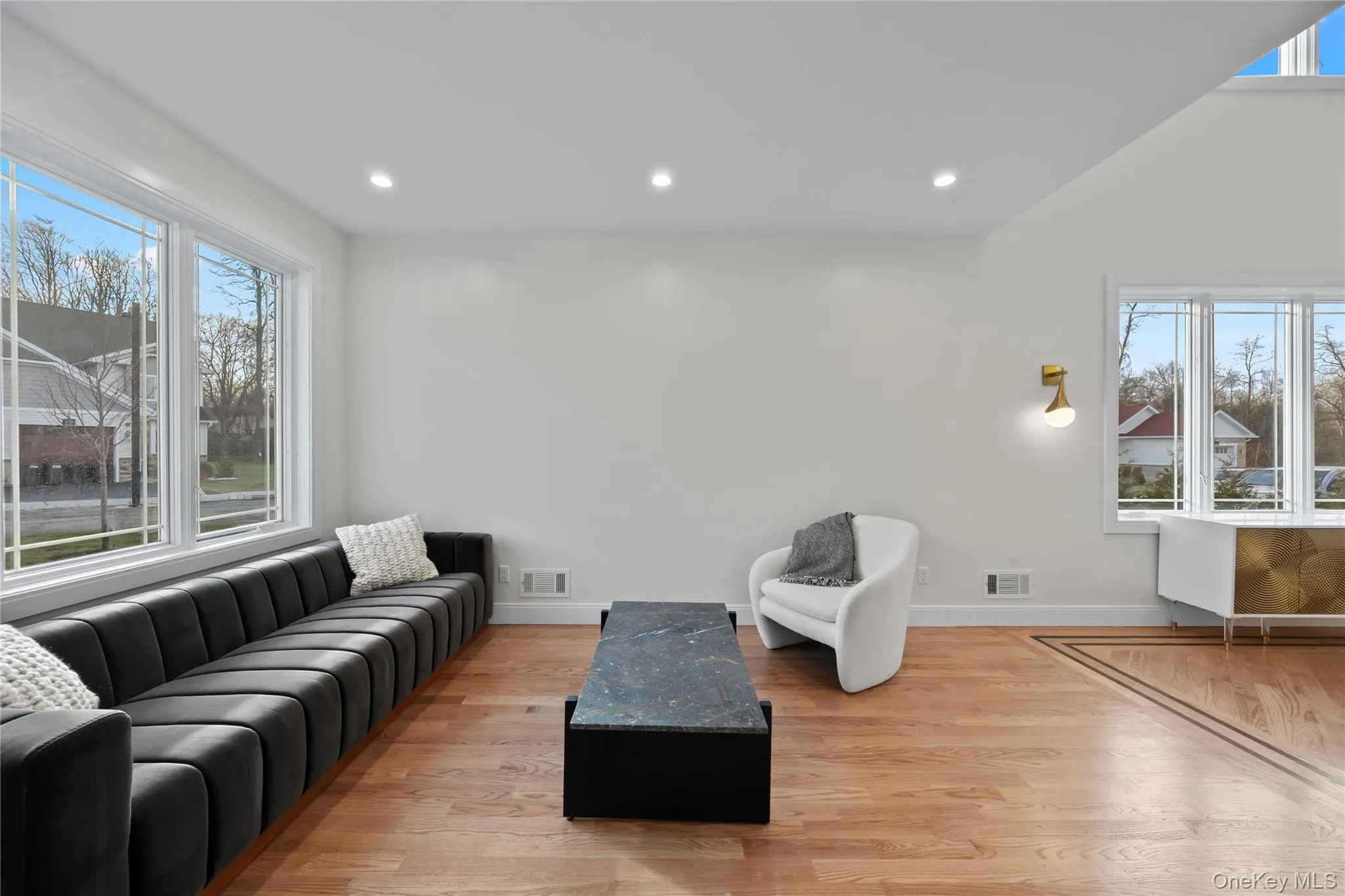 Living area featuring light wood-style floors and recessed lighting Living area featuring light wood-style floors and recessed lighting