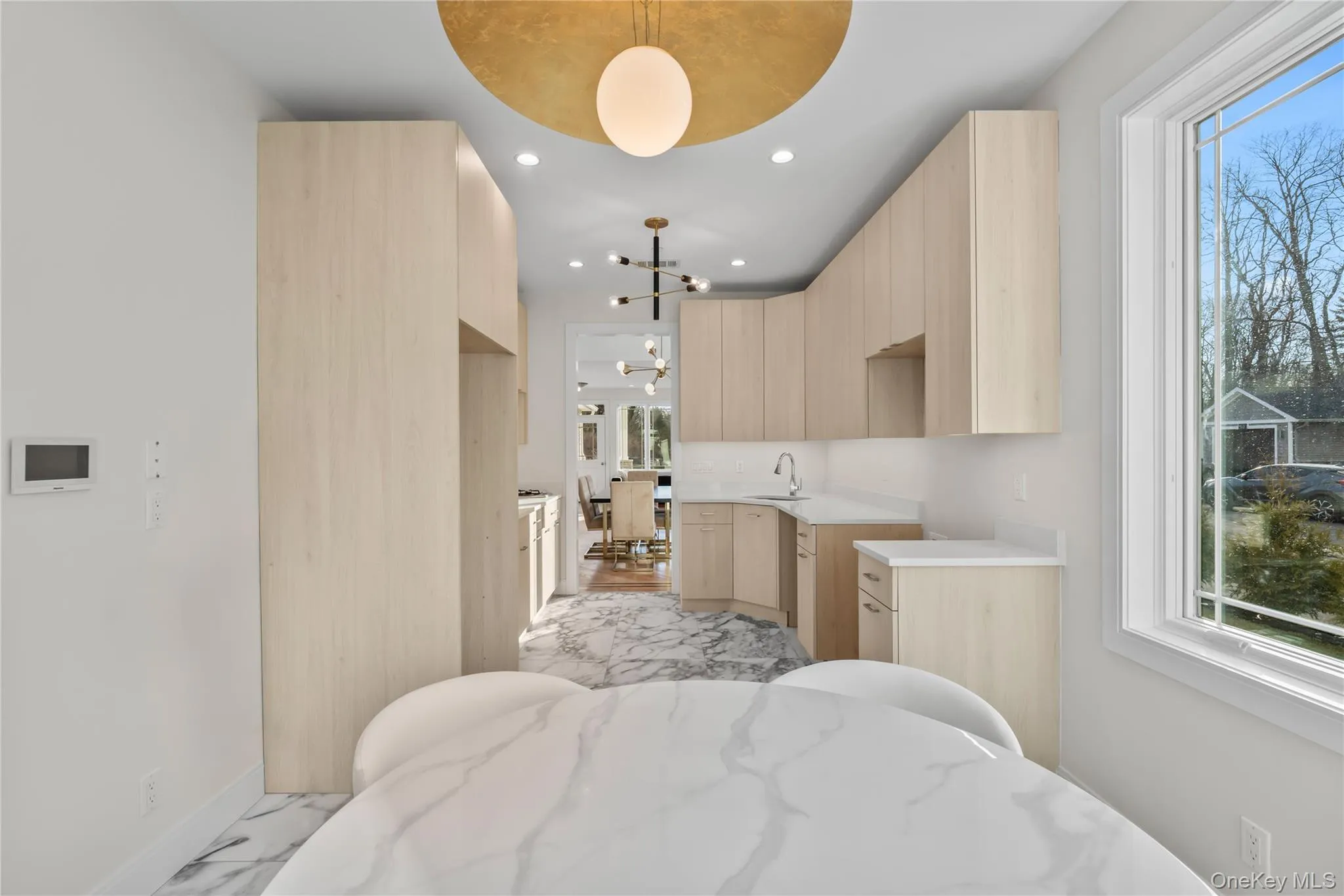 Bedroom featuring a chandelier, light marble finish floors, and recessed lighting Bedroom featuring a chandelier, light marble finish floors, and recessed lighting