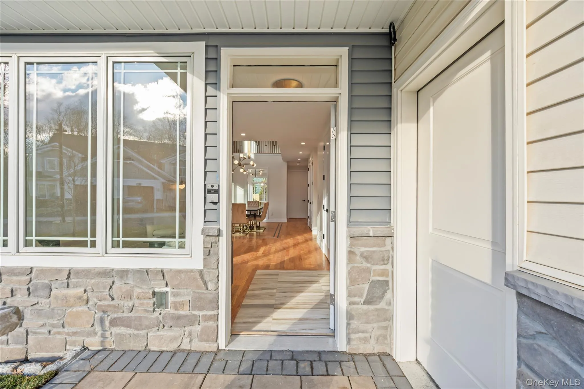 Entrance to property featuring stone siding Entrance to property featuring stone siding