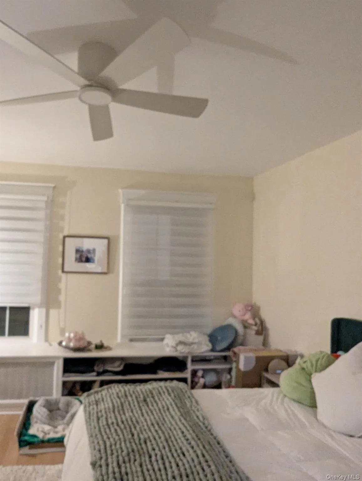 Bedroom with a ceiling fan Bedroom with a ceiling fan