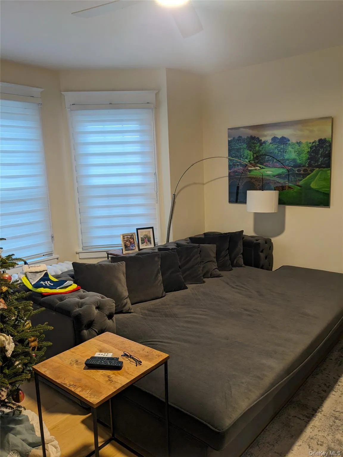 Bedroom featuring hardwood / wood-style floors and ceiling fan Bedroom featuring hardwood / wood-style floors and ceiling fan