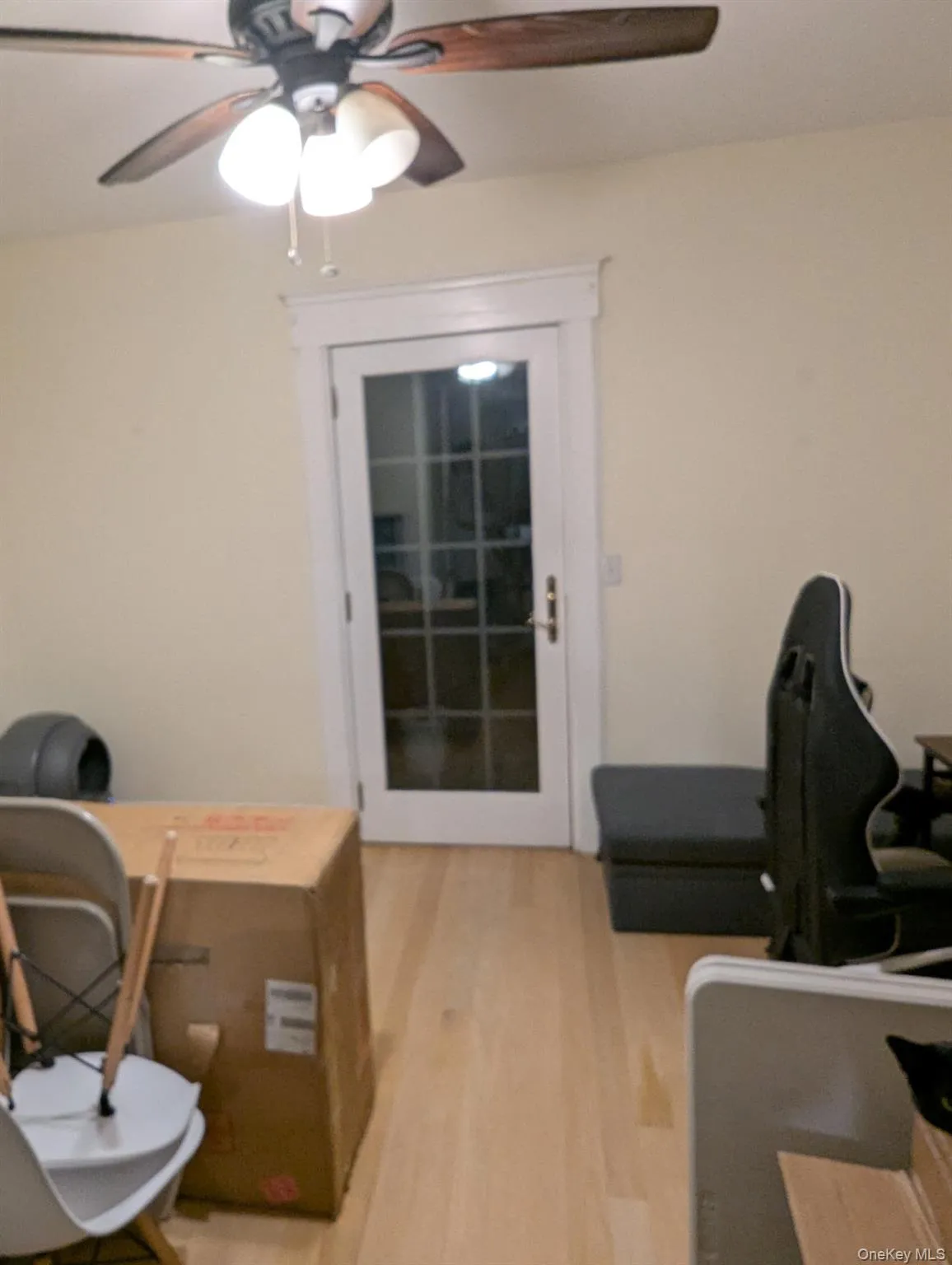 Office area featuring light wood-type flooring and a ceiling fan Office area featuring light wood-type flooring and a ceiling fan