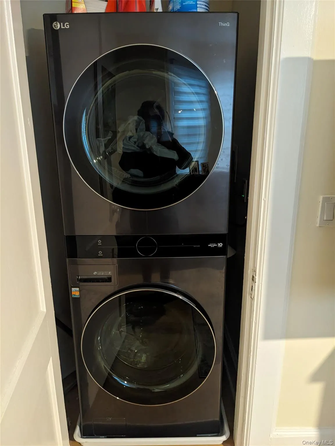 Washroom featuring stacked washer and clothes dryer Washroom featuring stacked washer and clothes dryer