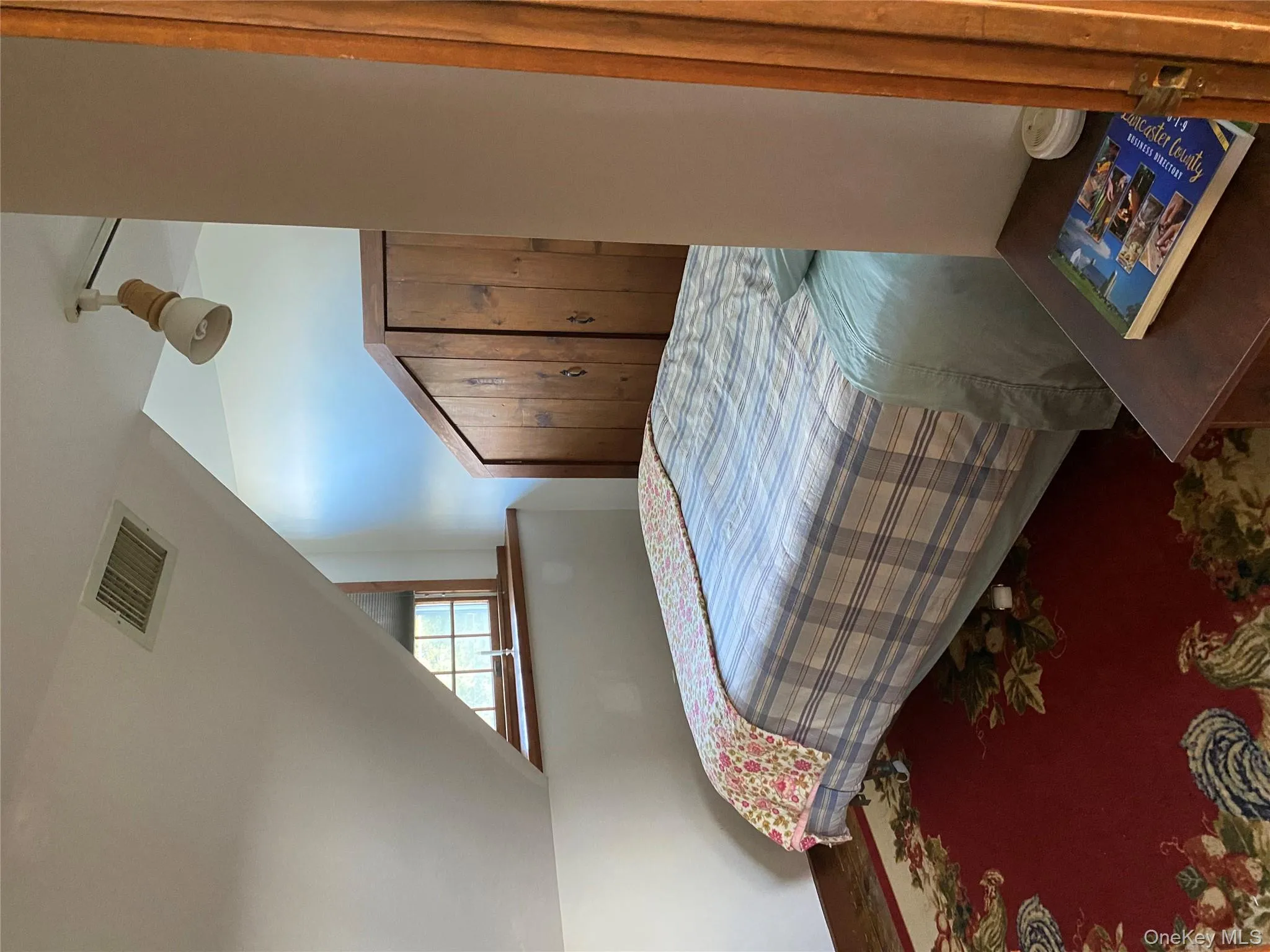 Bedroom featuring lofted ceiling Bedroom featuring lofted ceiling
