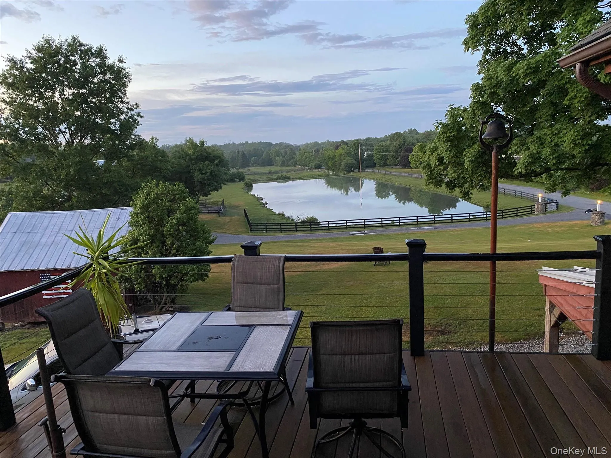 Deck with a water view and outdoor dining space Deck with a water view and outdoor dining space