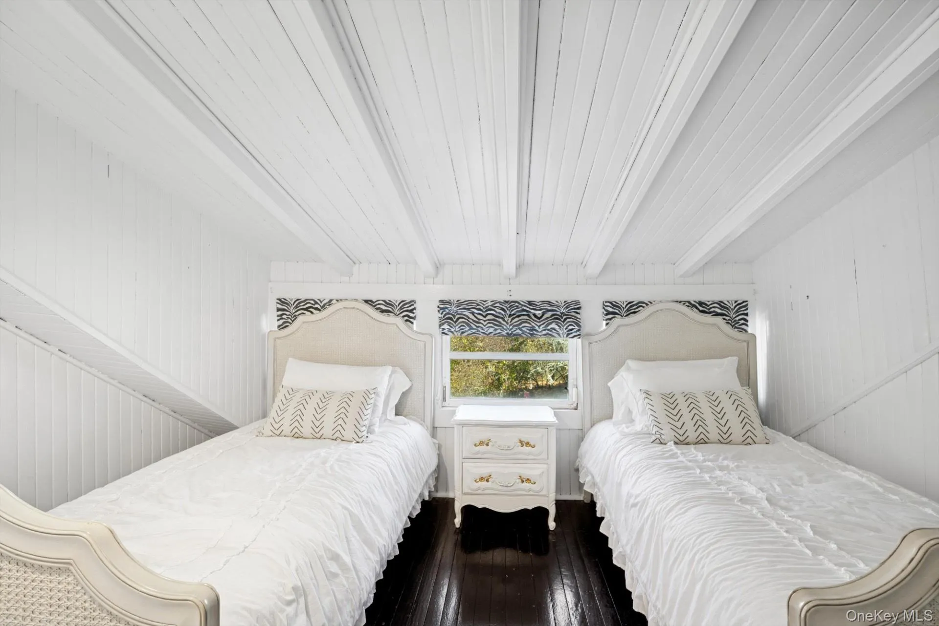 Bedroom featuring dark wood finished floors, wood walls, and wooden ceiling Bedroom featuring dark wood finished floors, wood walls, and wooden ceiling