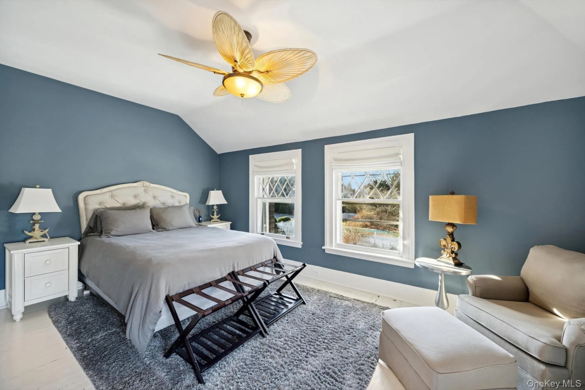 Bedroom featuring lofted ceiling and ceiling fan Bedroom featuring lofted ceiling and ceiling fan