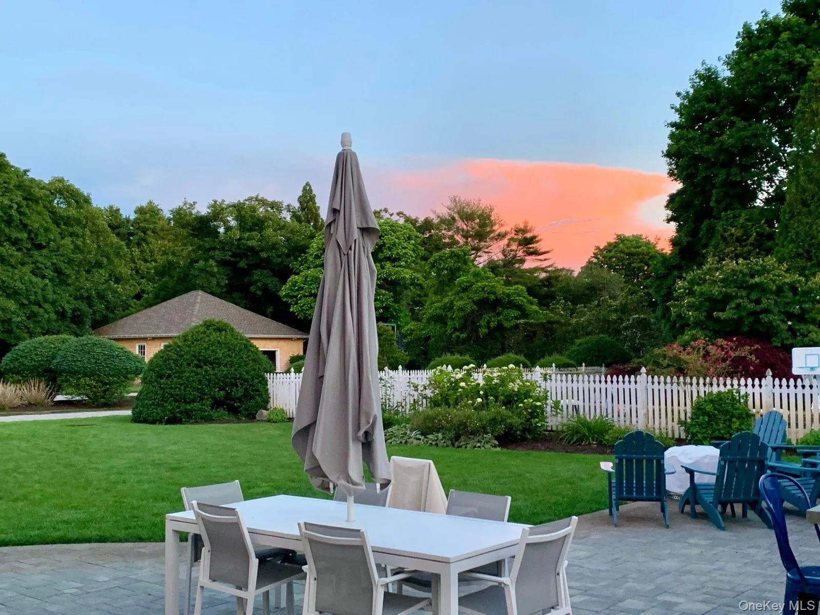 Patio terrace at dusk featuring outdoor dining area and a patio Patio terrace at dusk featuring outdoor dining area and a patio