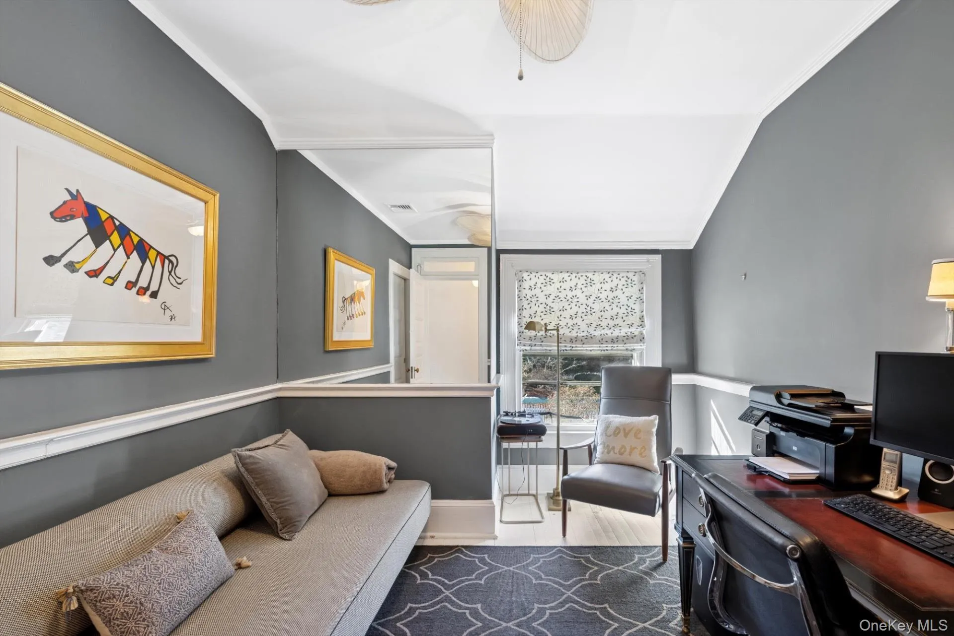 Office area with crown molding and dark wood-type flooring Office area with crown molding and dark wood-type flooring