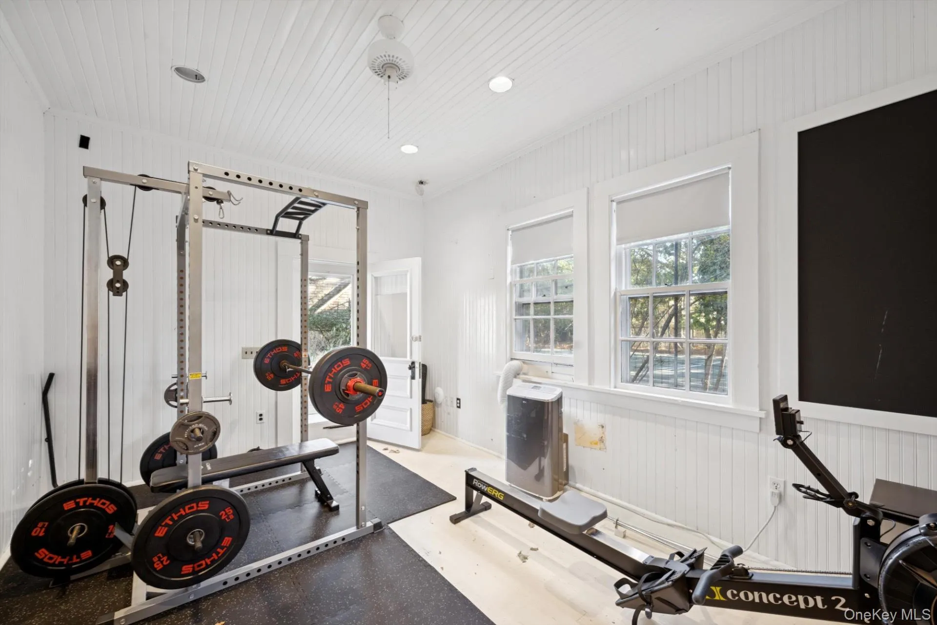 Exercise area featuring wood walls Exercise area featuring wood walls
