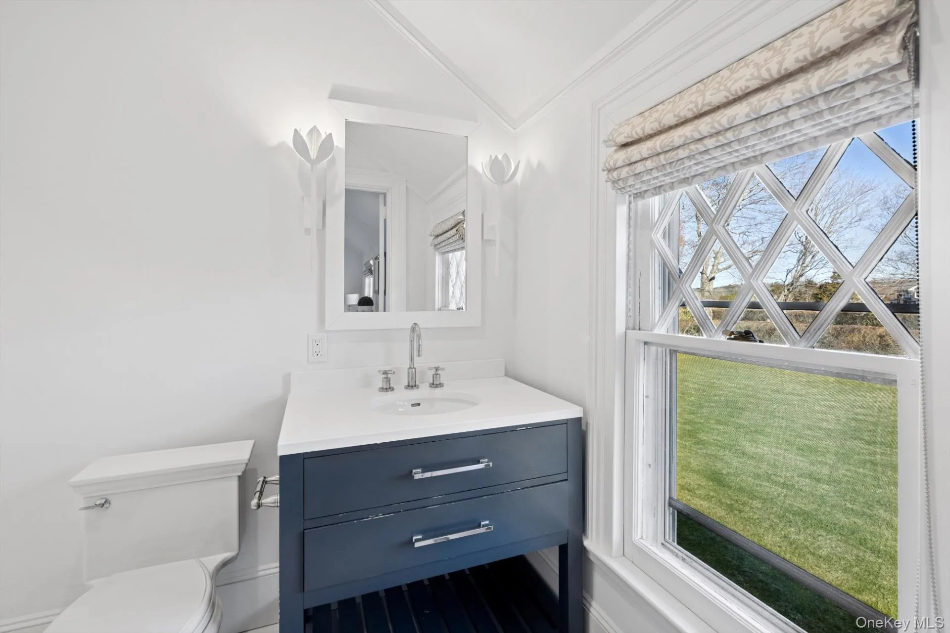 Half bathroom with vanity and crown molding Half bathroom with vanity and crown molding
