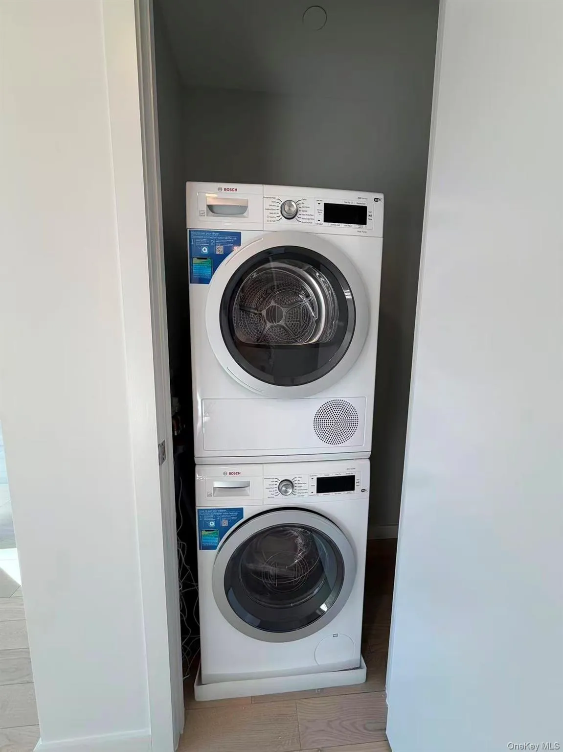 Washroom with stacked washer / dryer Washroom with stacked washer / dryer