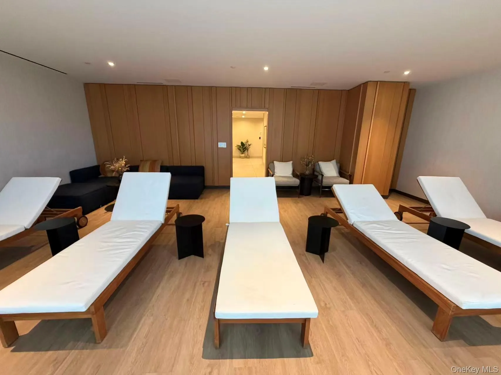 Living room featuring light wood-type flooring and recessed lighting Living room featuring light wood-type flooring and recessed lighting