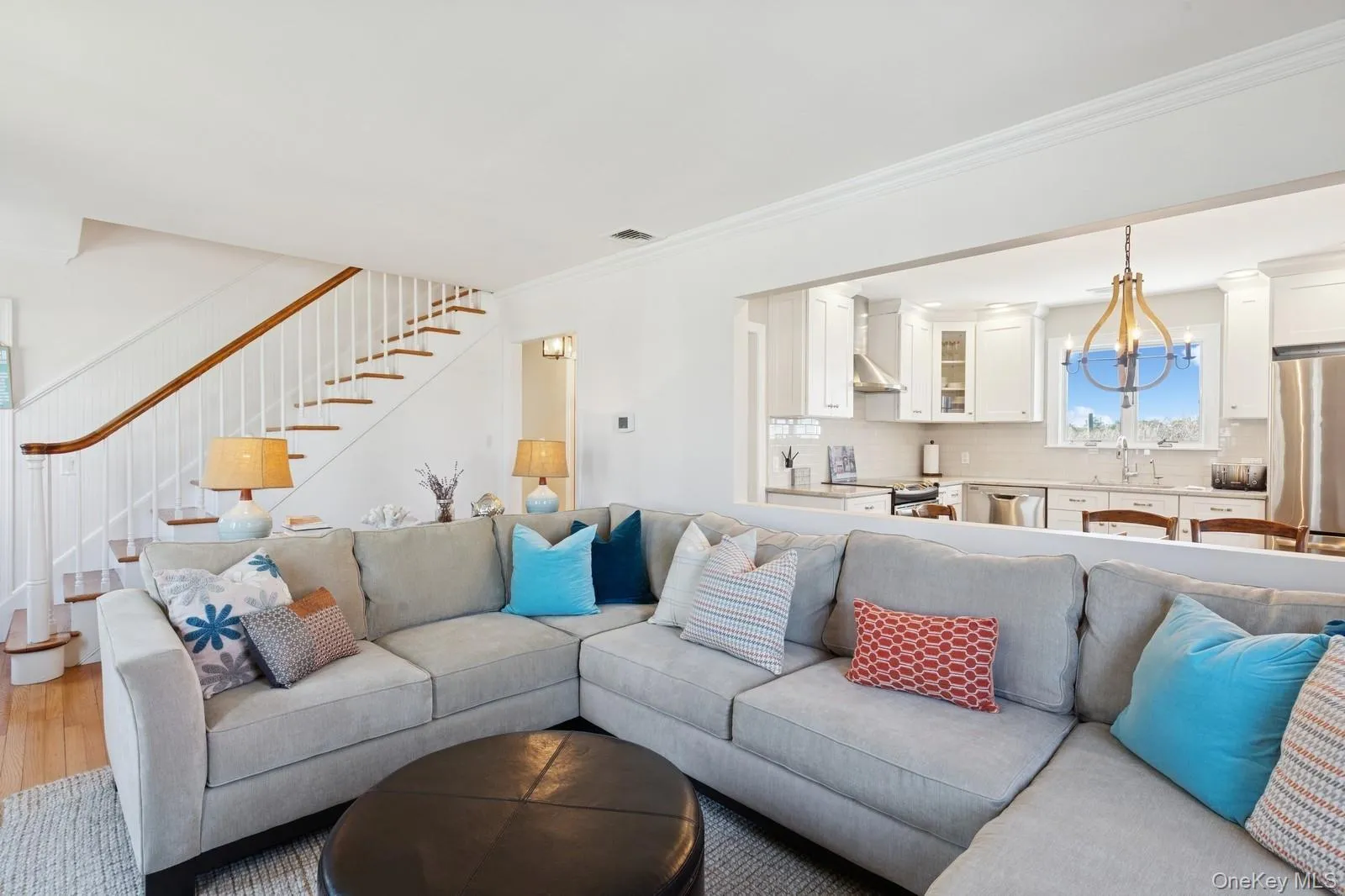 Living area with crown molding and stairway Living area with crown molding and stairway