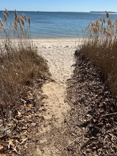 Water view featuring nearby beach Water view featuring nearby beach