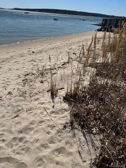 Water view featuring nearby beach Water view featuring nearby beach