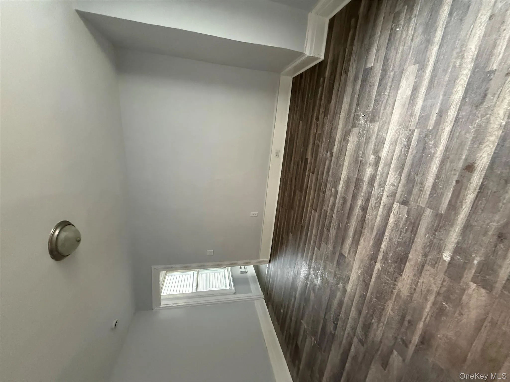 Empty room with dark wood finished floors Empty room with dark wood finished floors