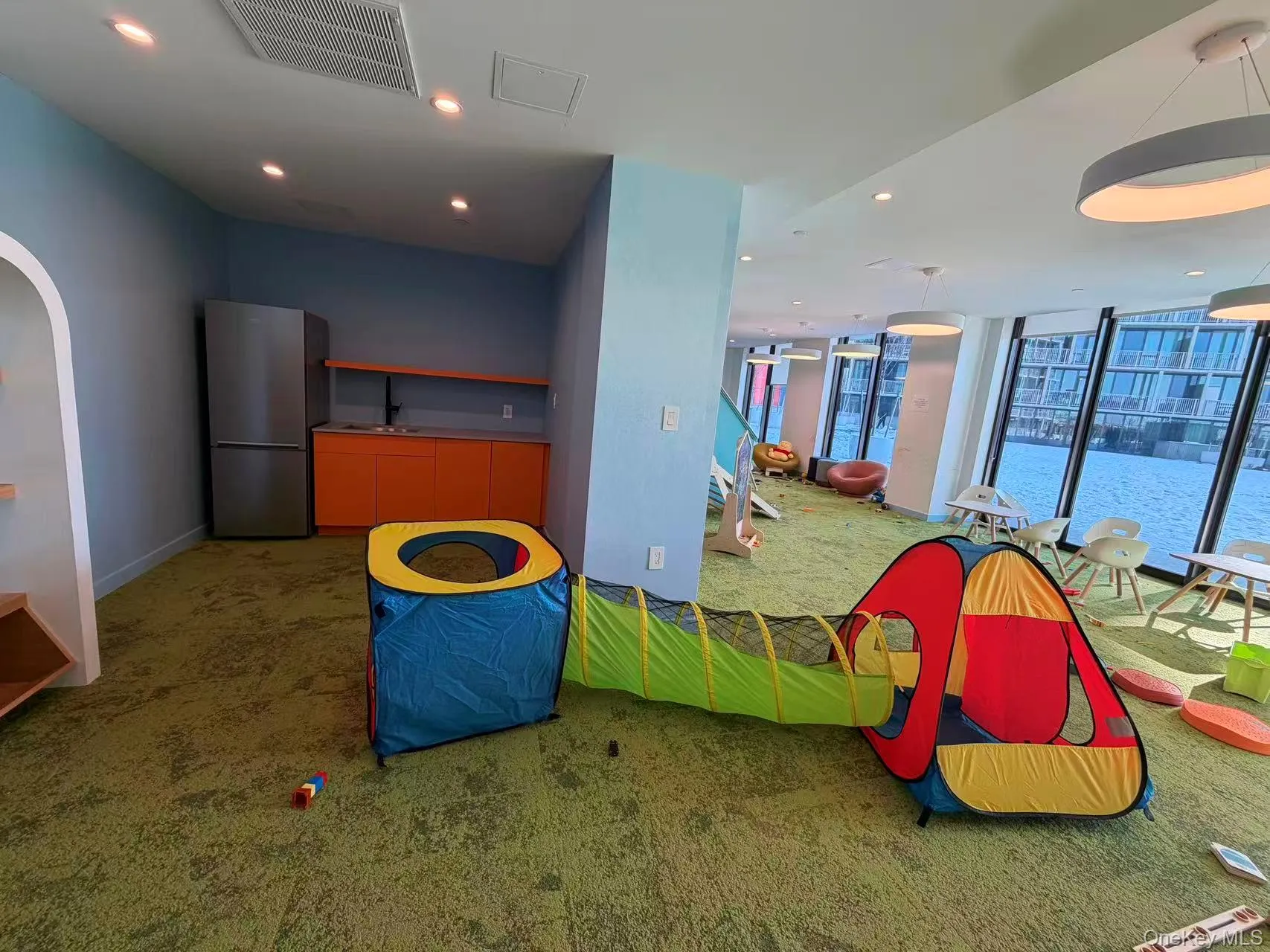 Rec room featuring recessed lighting and expansive windows Rec room featuring recessed lighting and expansive windows