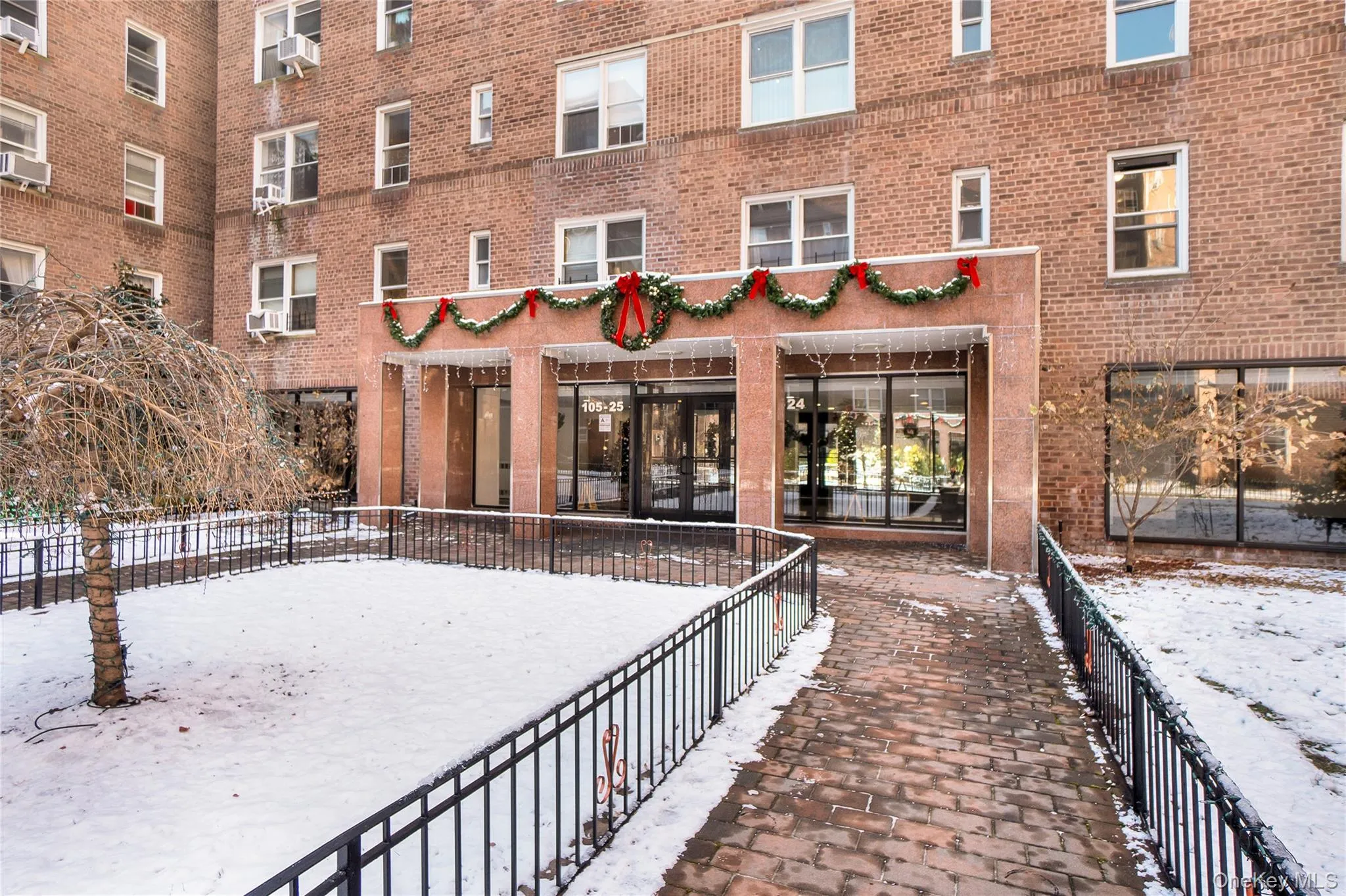 Snow covered property with a view of apartment building / complex Snow covered property with a view of apartment building / complex