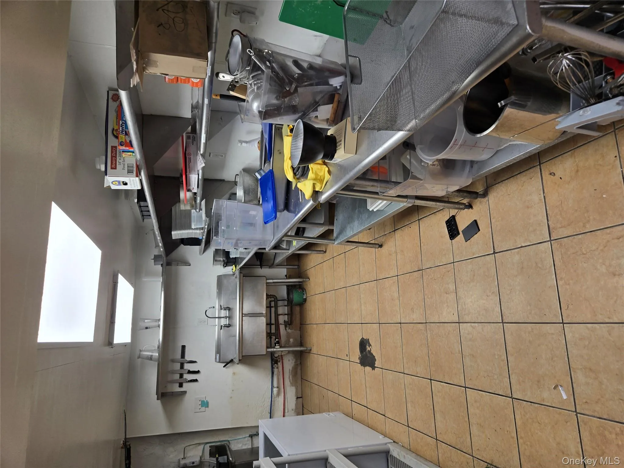 Kitchen featuring a skylight and washer / clothes dryer Kitchen featuring a skylight and washer / clothes dryer