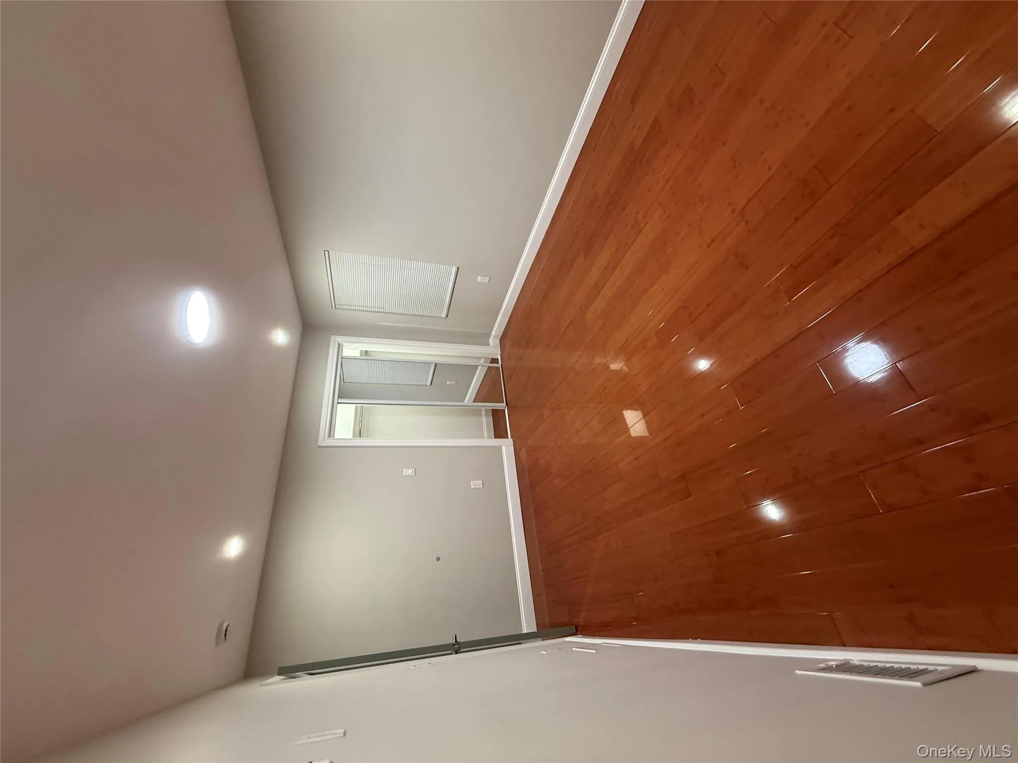 Spare room with hardwood / wood-style floors and recessed lighting Spare room with hardwood / wood-style floors and recessed lighting