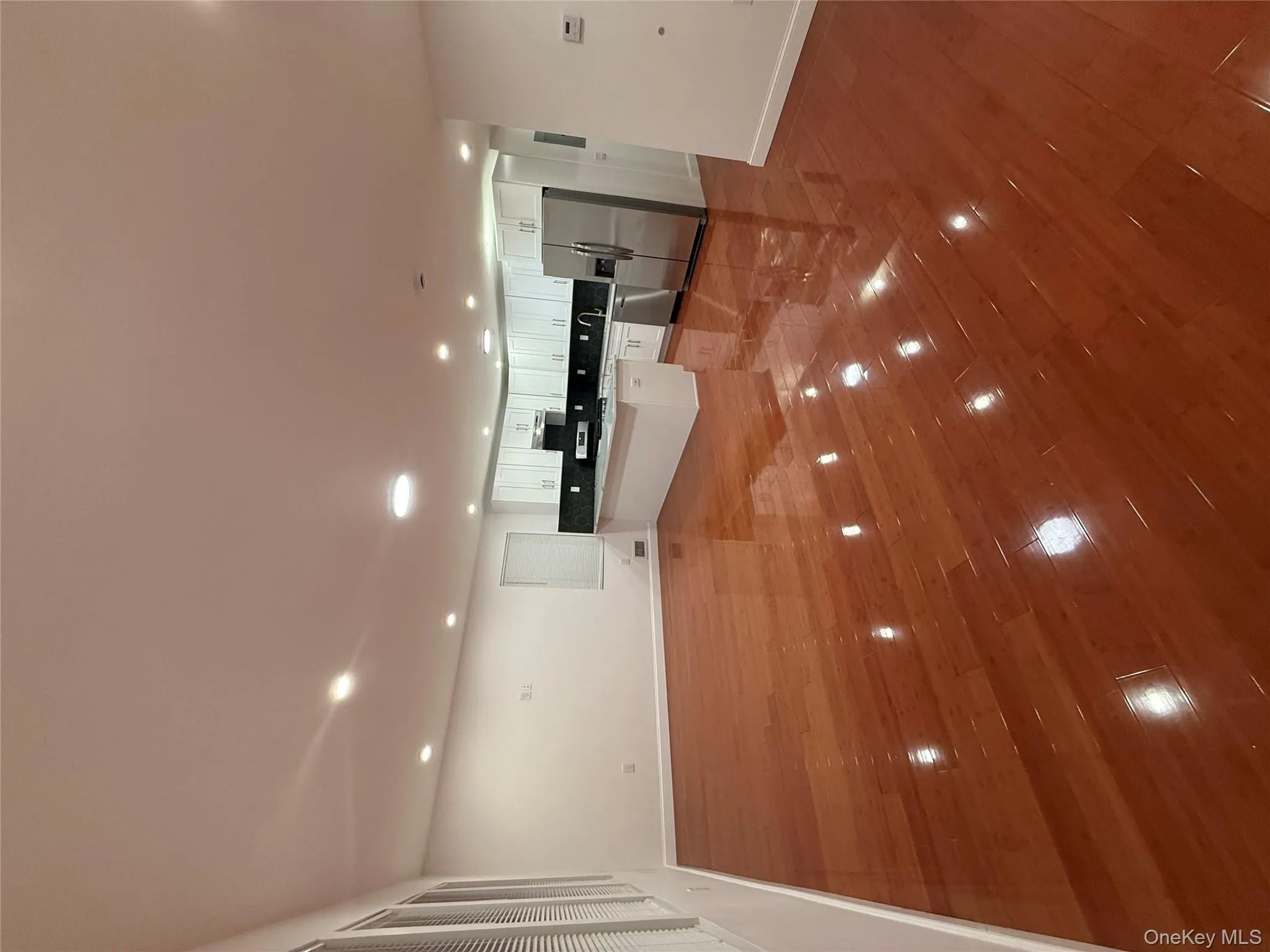 Unfurnished living room featuring recessed lighting and light wood-type flooring Unfurnished living room featuring recessed lighting and light wood-type flooring