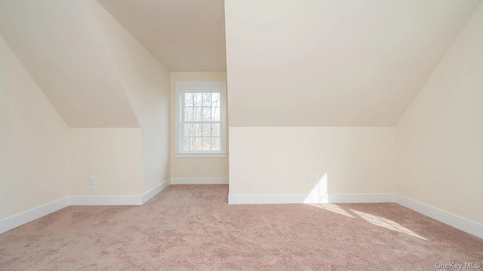 Bonus room featuring light carpet and lofted ceiling Bonus room featuring light carpet and lofted ceiling