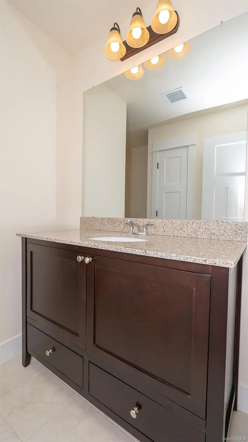 Bathroom featuring vanity Bathroom featuring vanity