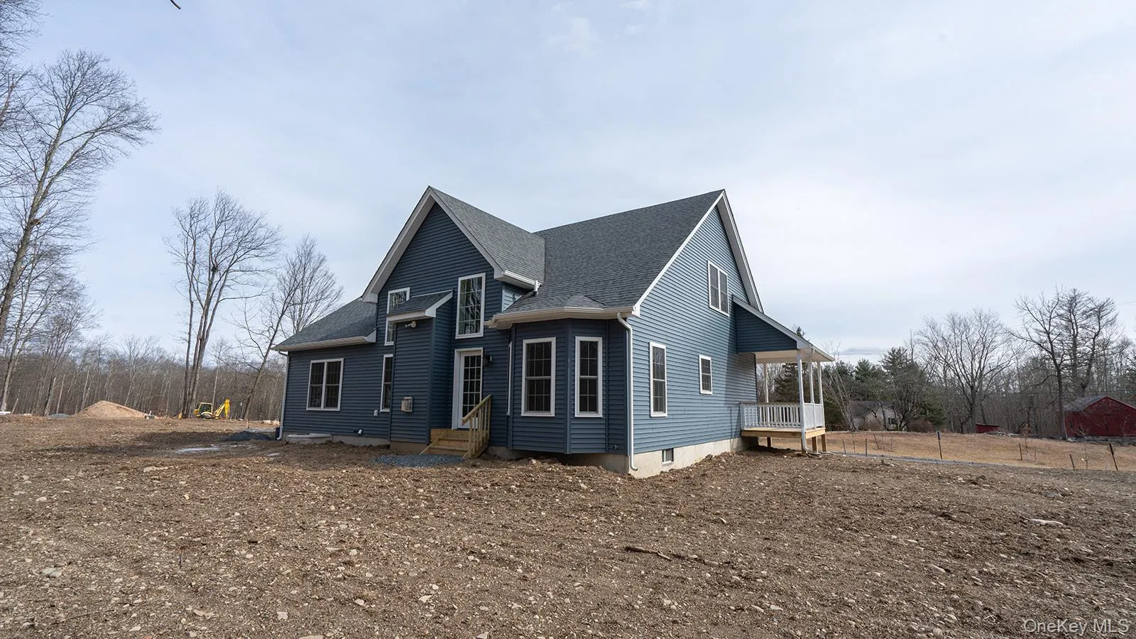 View of side of property featuring roof with shingles View of side of property featuring roof with shingles
