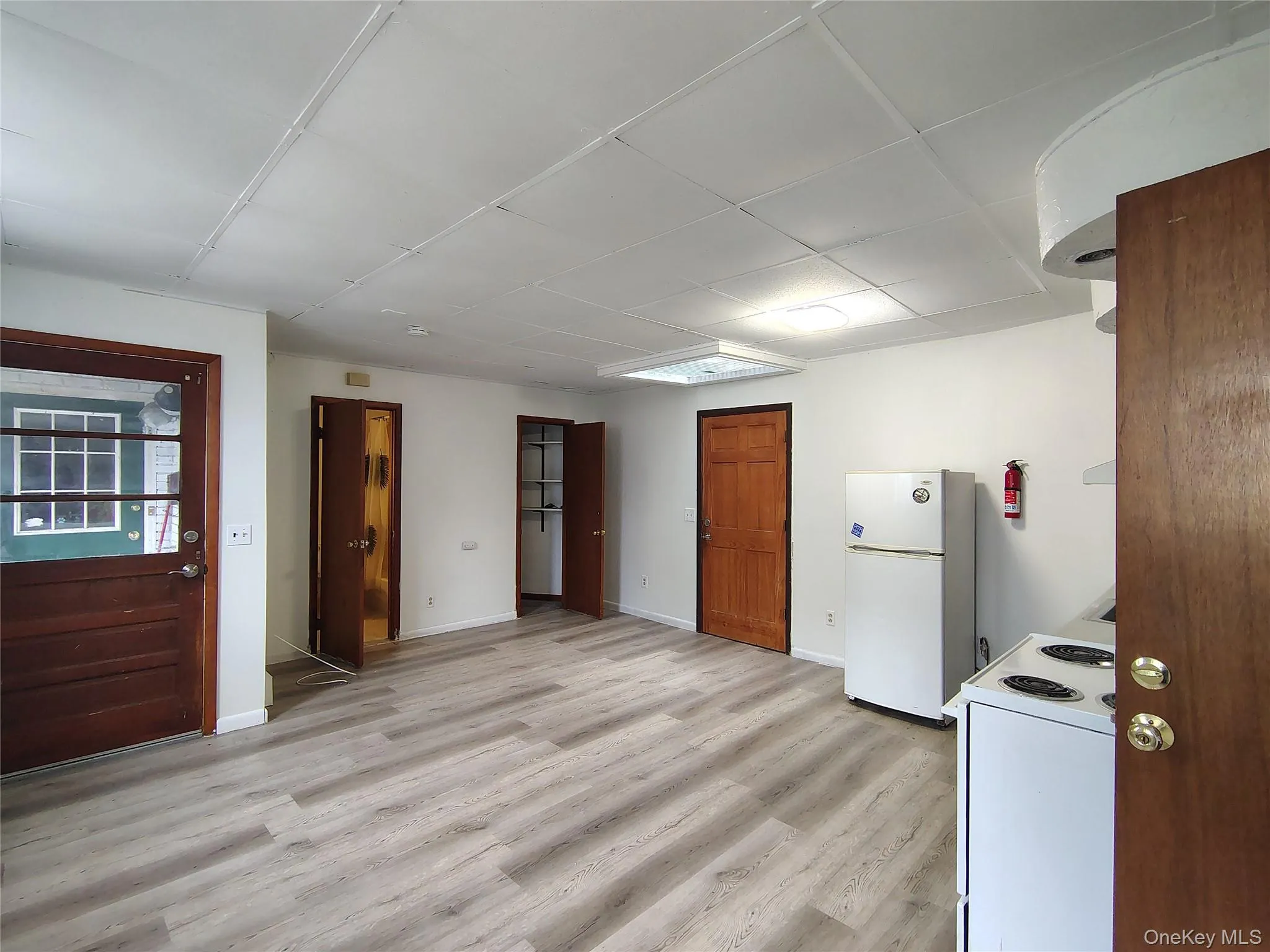 Kitchen featuring white appliances and light wood-style floors Kitchen featuring white appliances and light wood-style floors