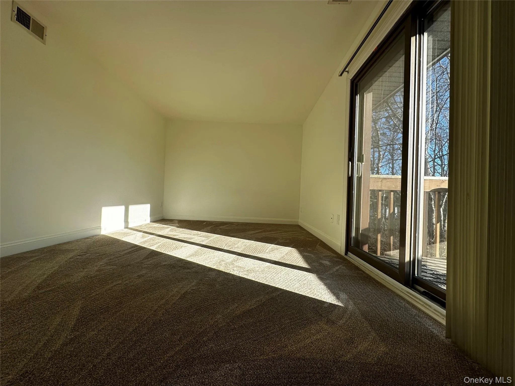 Bright bedroom with sliding doors. Bright bedroom with sliding doors.