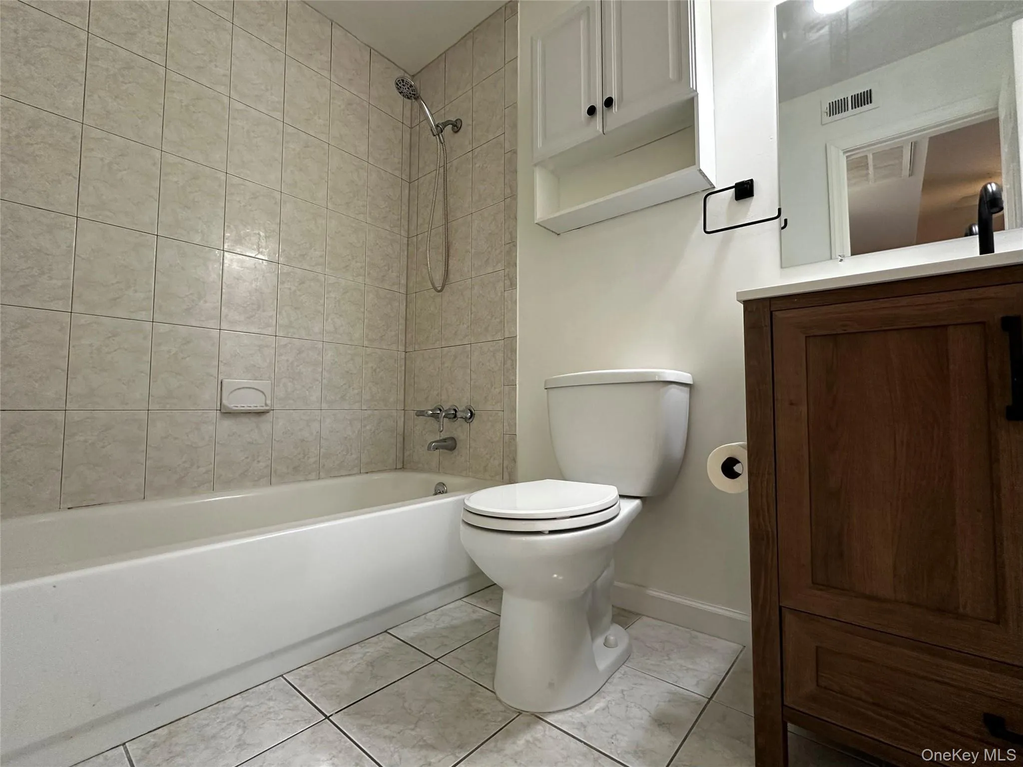 Full bathroom with shower / tub combination and vanity Full bathroom with shower / tub combination and vanity