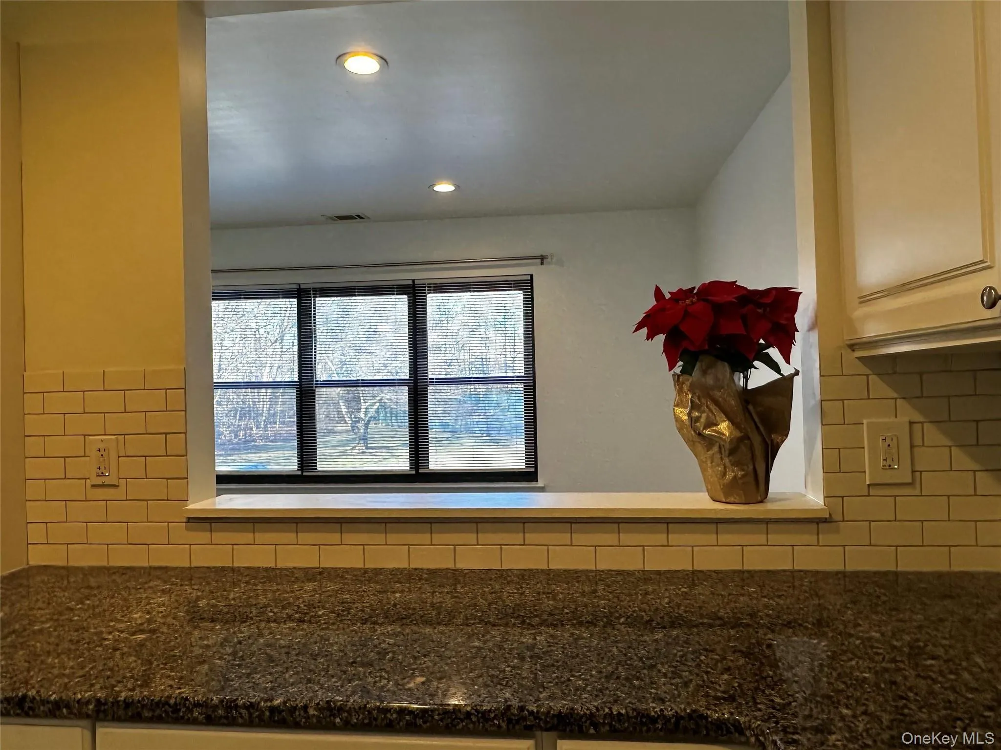 Kitchen cut-out to living room. Kitchen cut-out to living room.