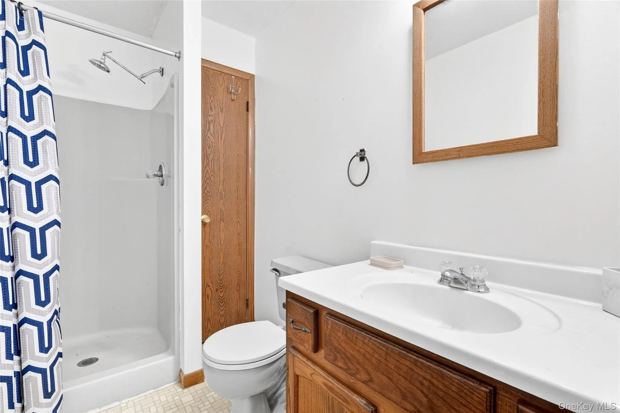 Full bath with a stall shower and vanity Full bath with a stall shower and vanity