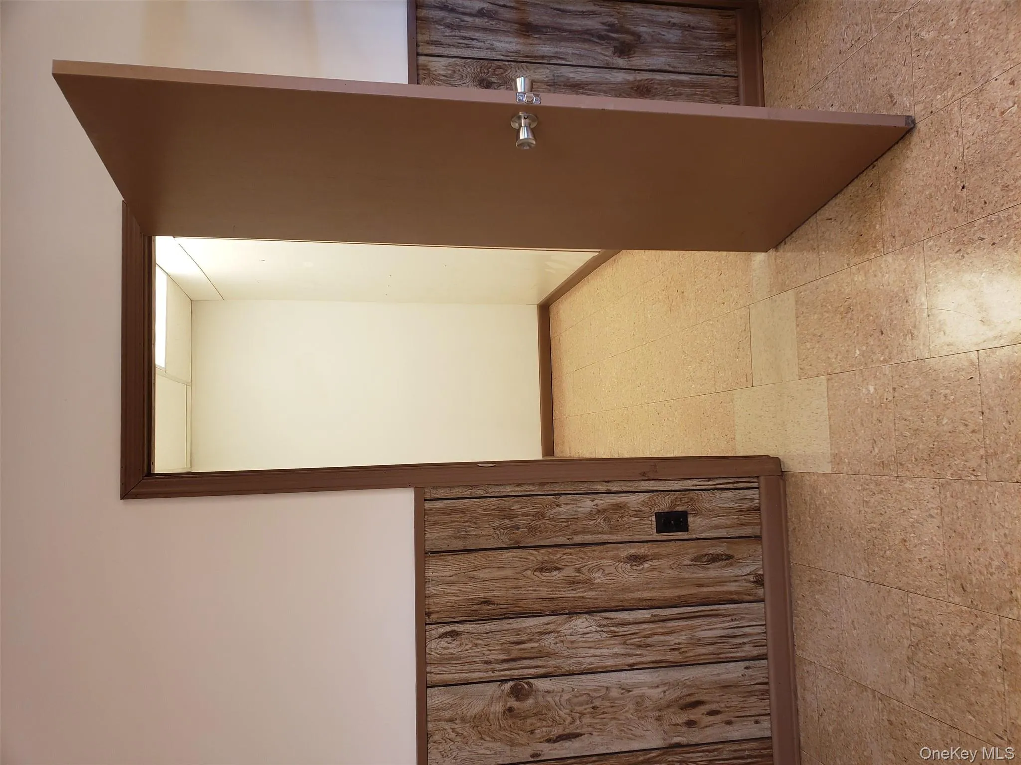 Hall with light floors and wooden walls Hall with light floors and wooden walls