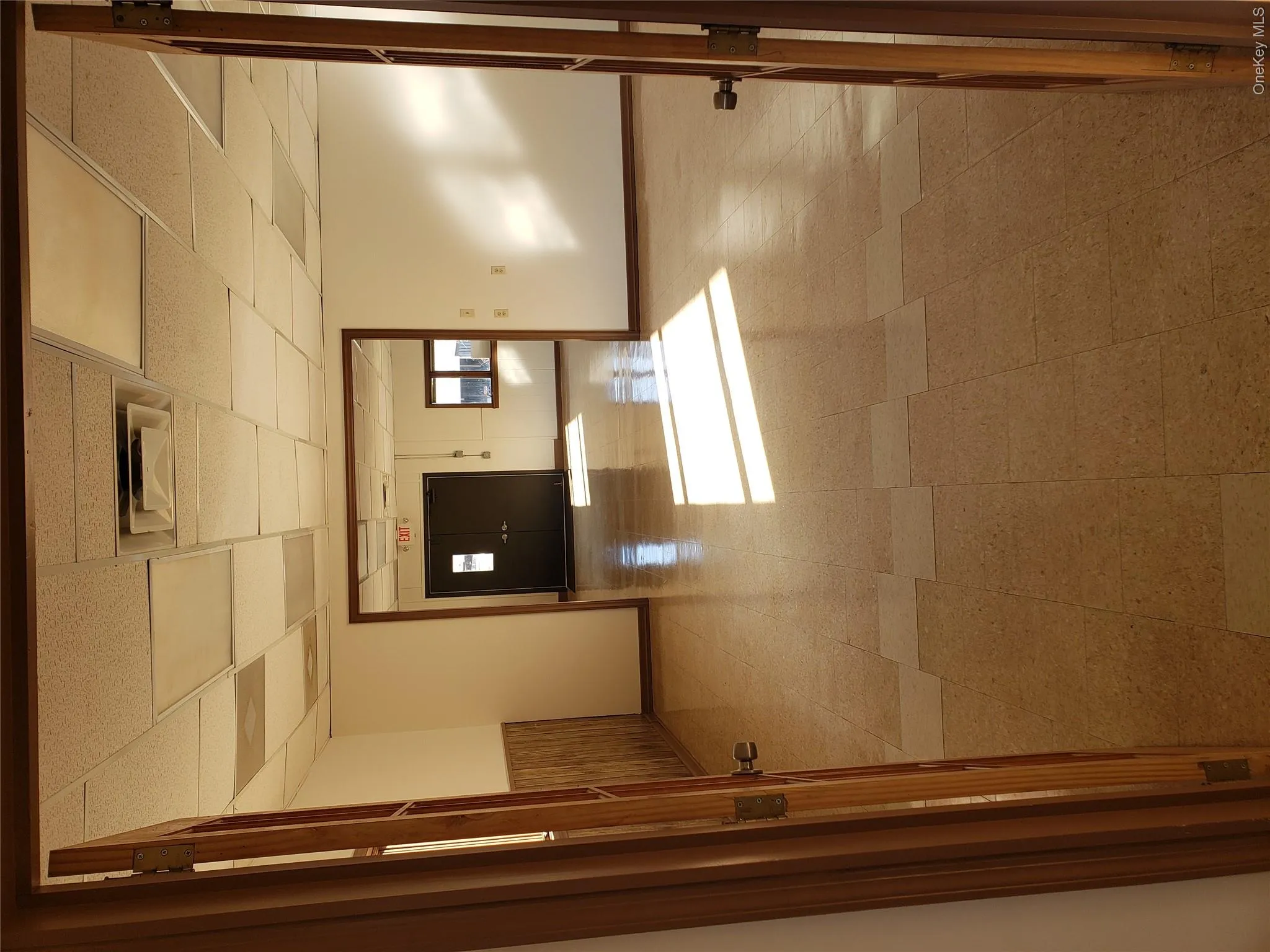 Unfurnished room featuring a drop ceiling and tile patterned floors Unfurnished room featuring a drop ceiling and tile patterned floors