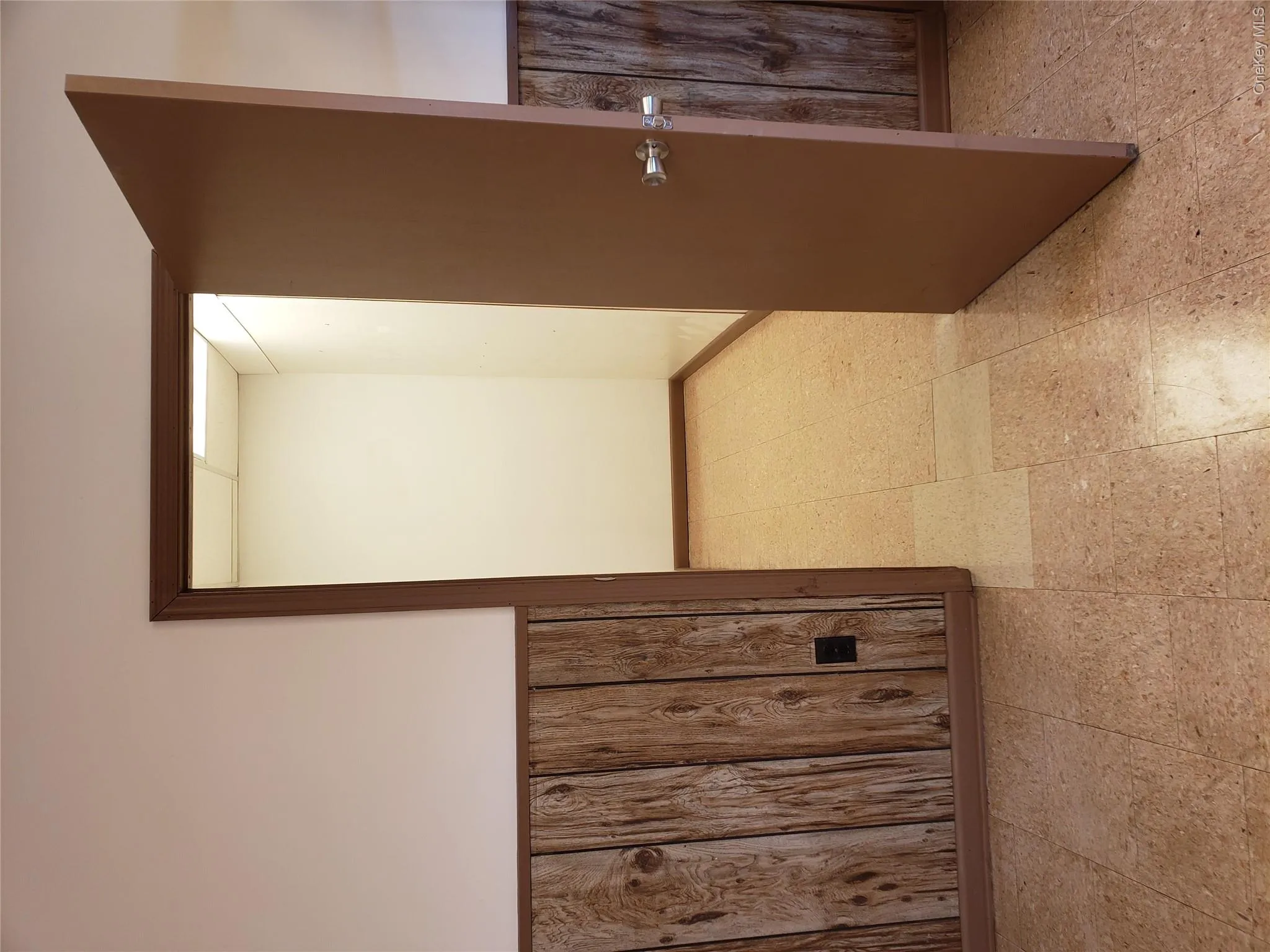 Hall with light floors and wooden walls Hall with light floors and wooden walls