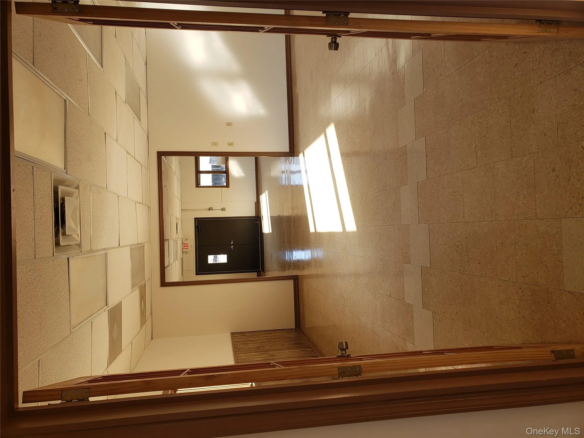 Unfurnished room featuring a drop ceiling and tile patterned floors Unfurnished room featuring a drop ceiling and tile patterned floors