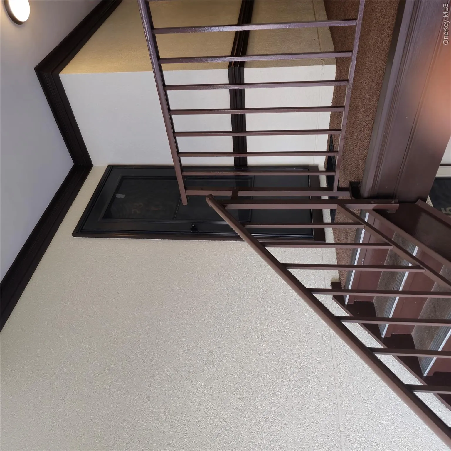 Stairs with ornamental molding and a textured wall Stairs with ornamental molding and a textured wall