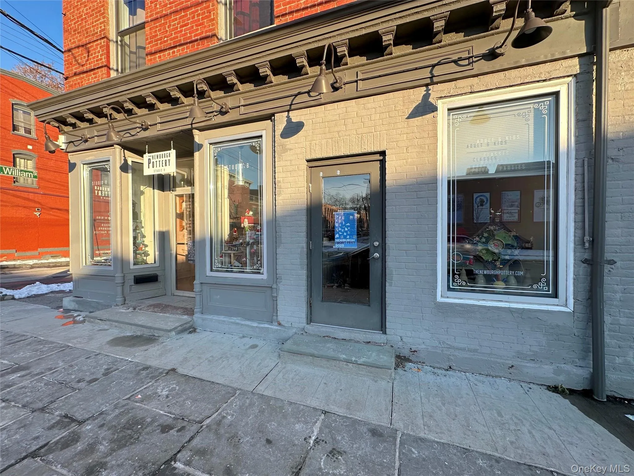Property entrance featuring brick siding Property entrance featuring brick siding