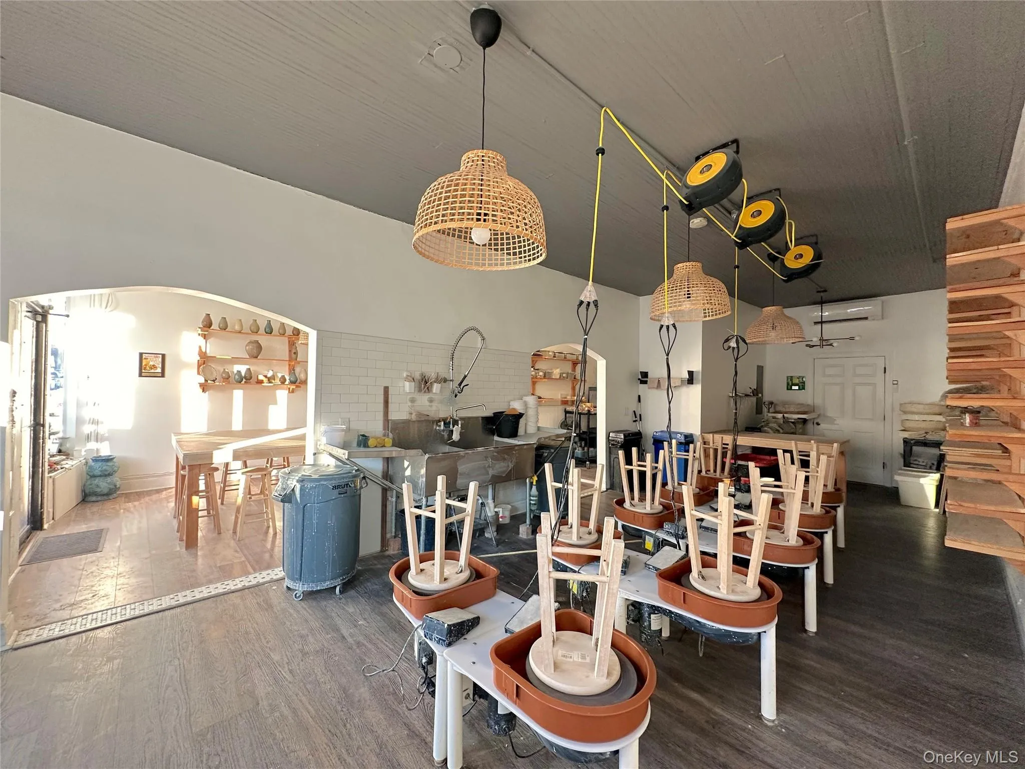 Misc room featuring arched walkways and dark wood-type flooring Misc room featuring arched walkways and dark wood-type flooring