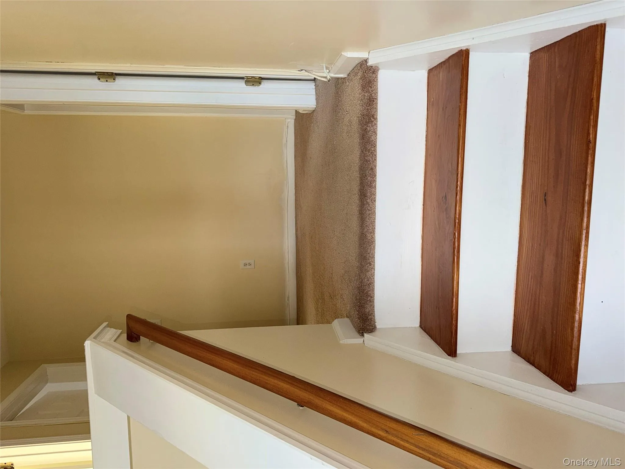 Stairway with carpet flooring and baseboards Stairway with carpet flooring and baseboards