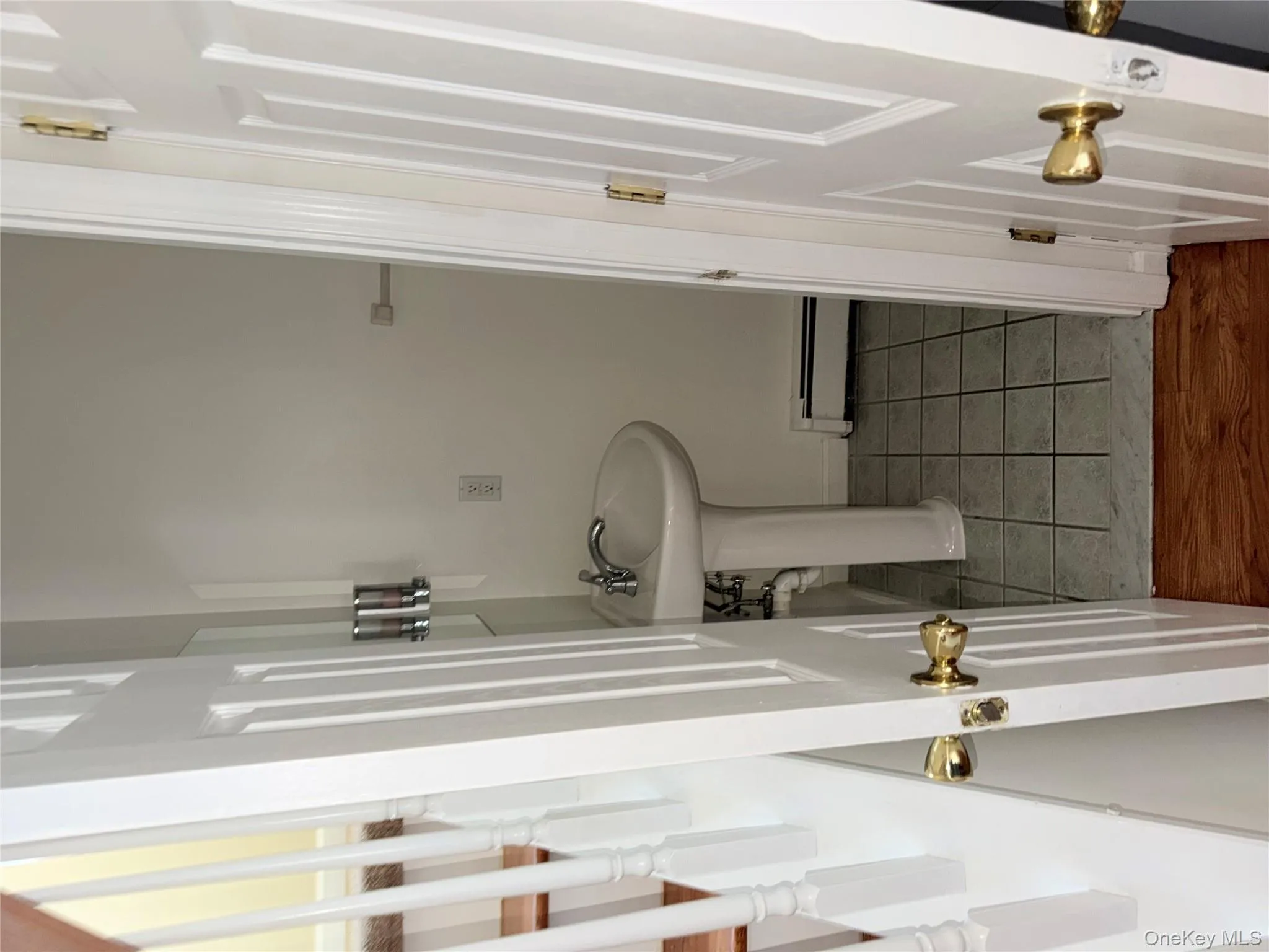 Bathroom with baseboard heating and tile patterned flooring Bathroom with baseboard heating and tile patterned flooring