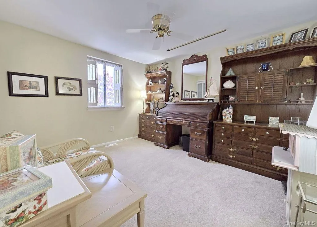 Bedroom with light carpet and ceiling fan Bedroom with light carpet and ceiling fan