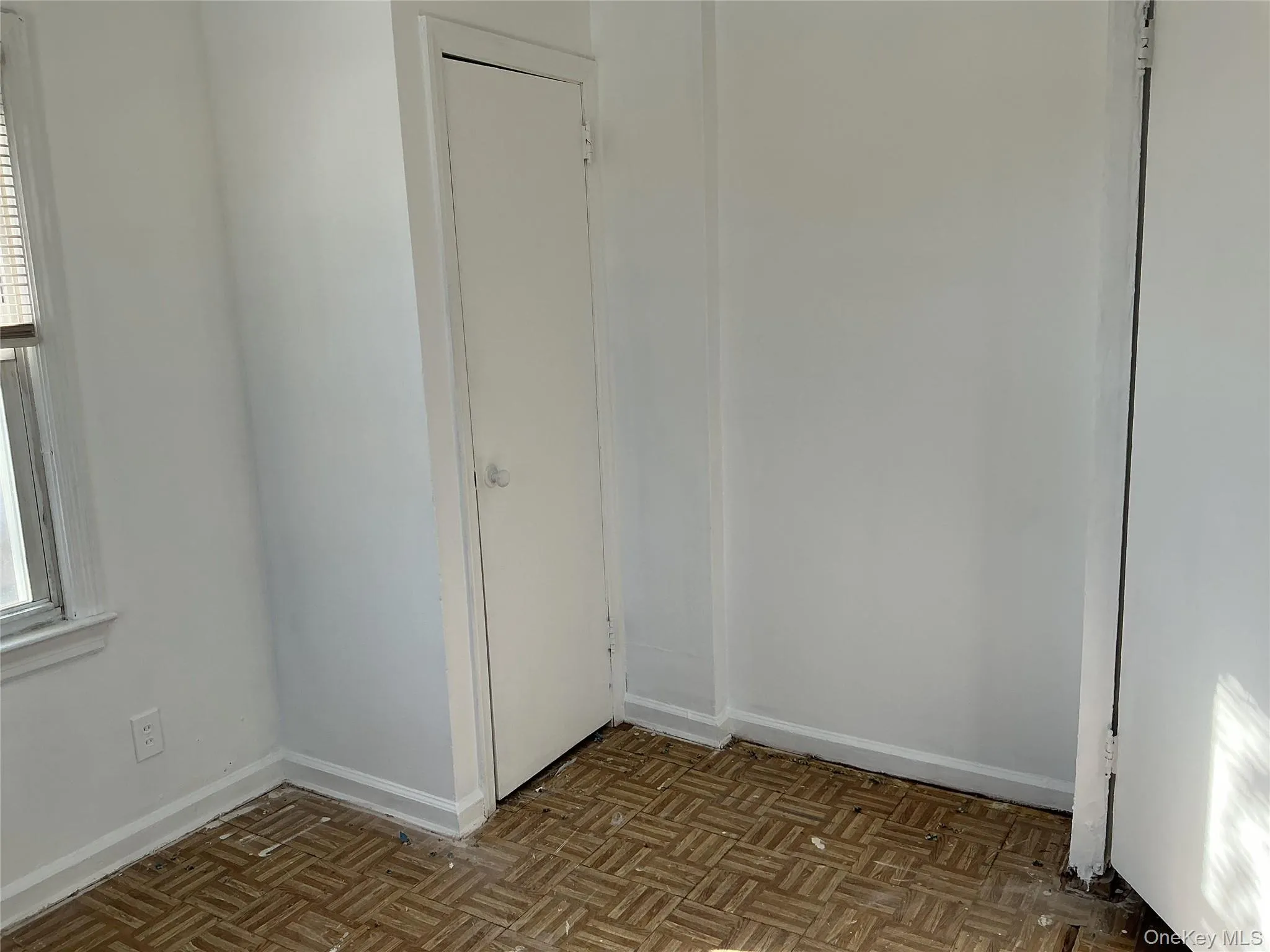 Empty room with baseboards Empty room with baseboards