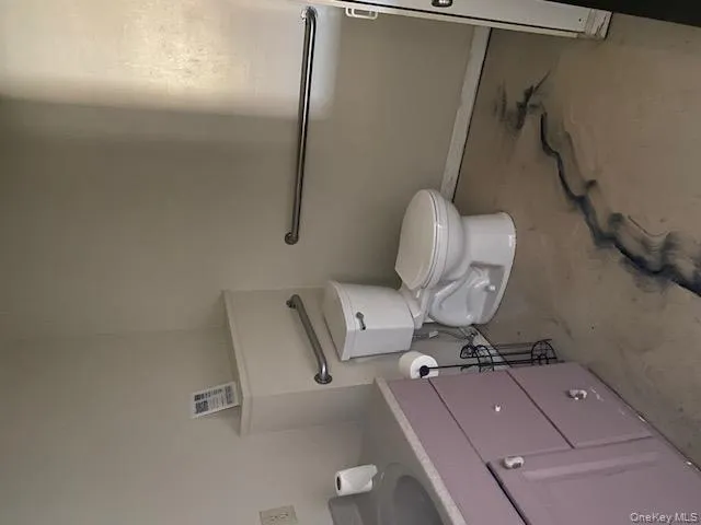 Bathroom with vanity and concrete flooring Bathroom with vanity and concrete flooring